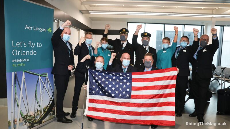 people waving American flag in room