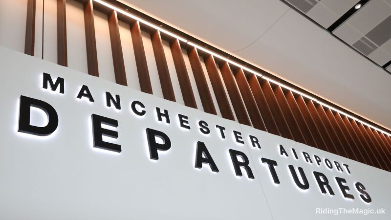Manchester Airport Departures sign with a modern design and lighting