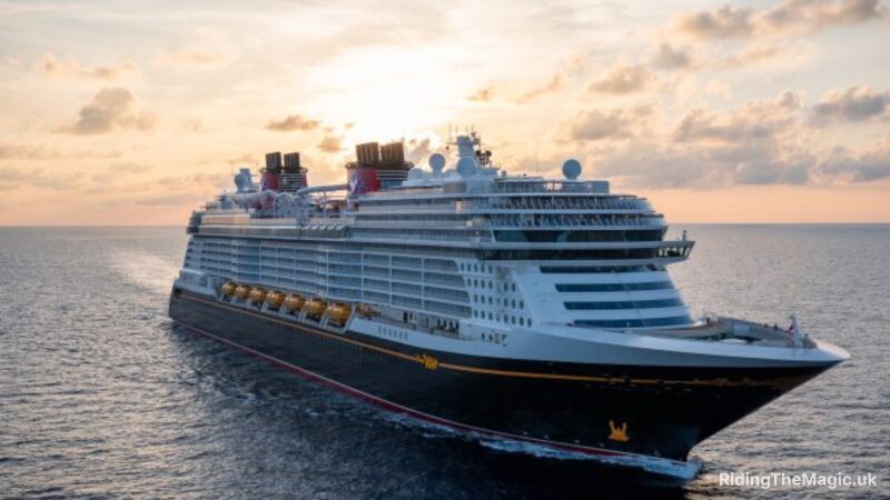 Disney cruise ship sailing in the ocean at sunset